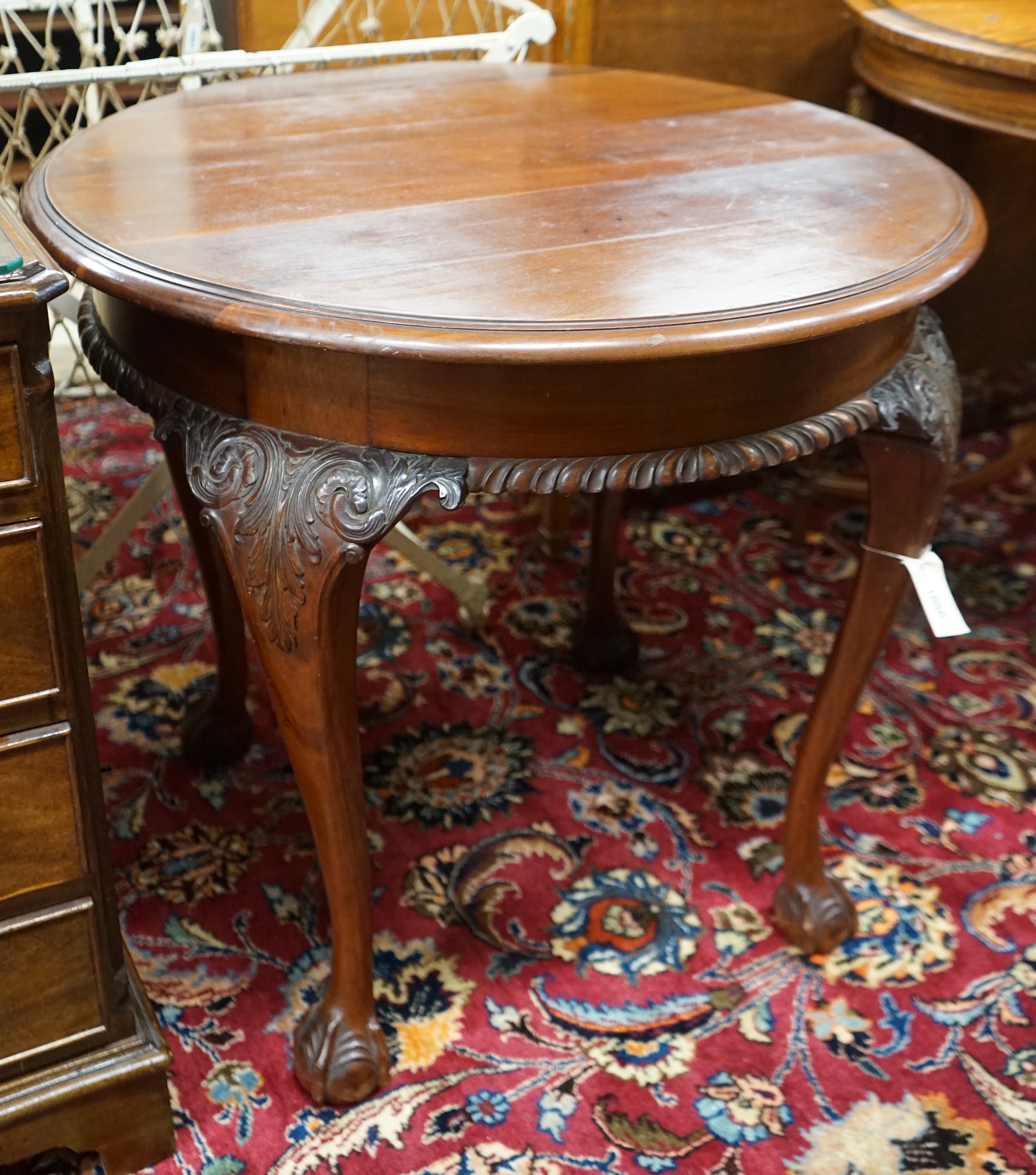 An early 20th century Chippendale revival circular mahogany centre table, diameter 73cm, height 70cm